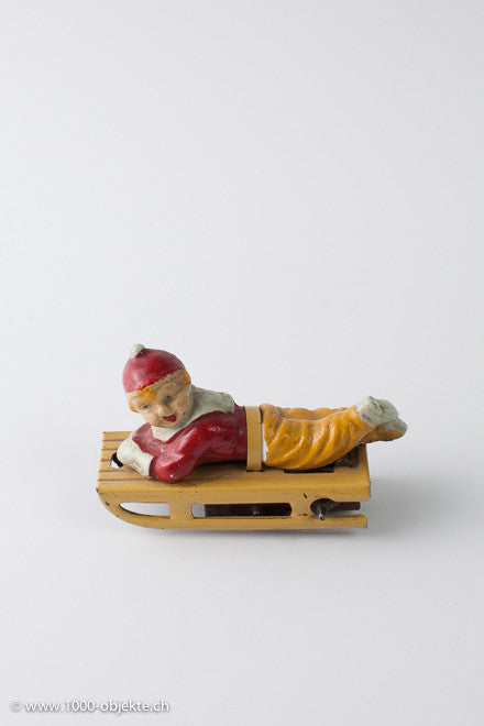 Gescha figure boy on sled, 50's.