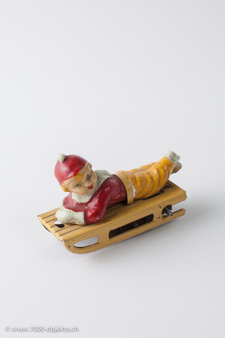 Gescha figure boy on sled, 50's.